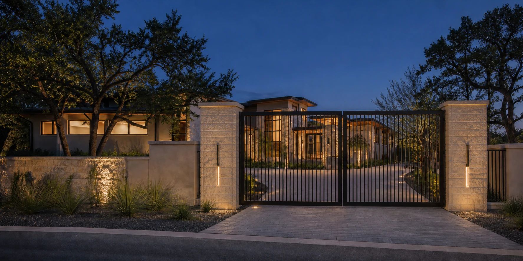 Modern automated steel driveway gate at a contemporary Texas residence