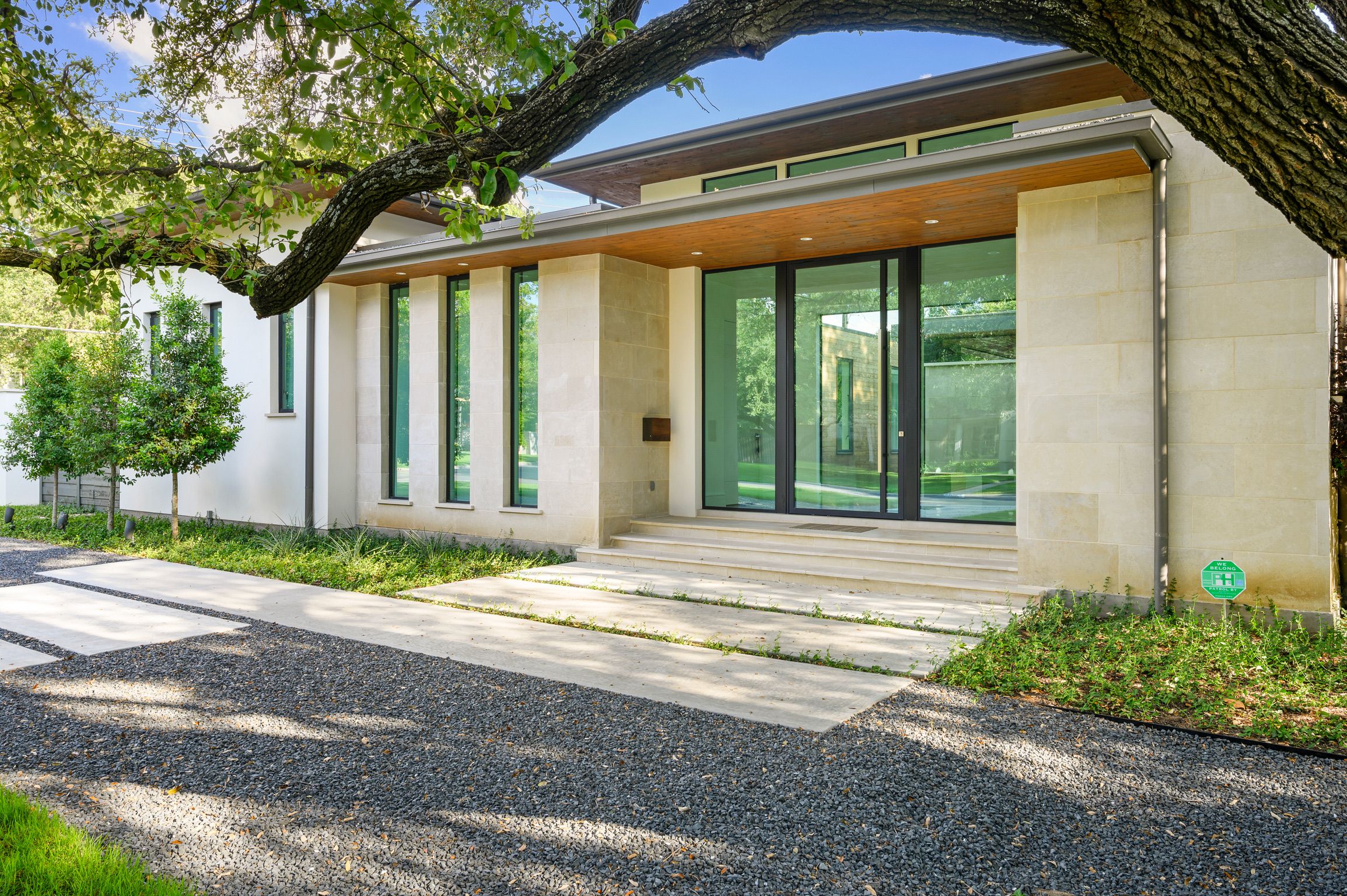 Exterior entry approach with steel-framed glazing