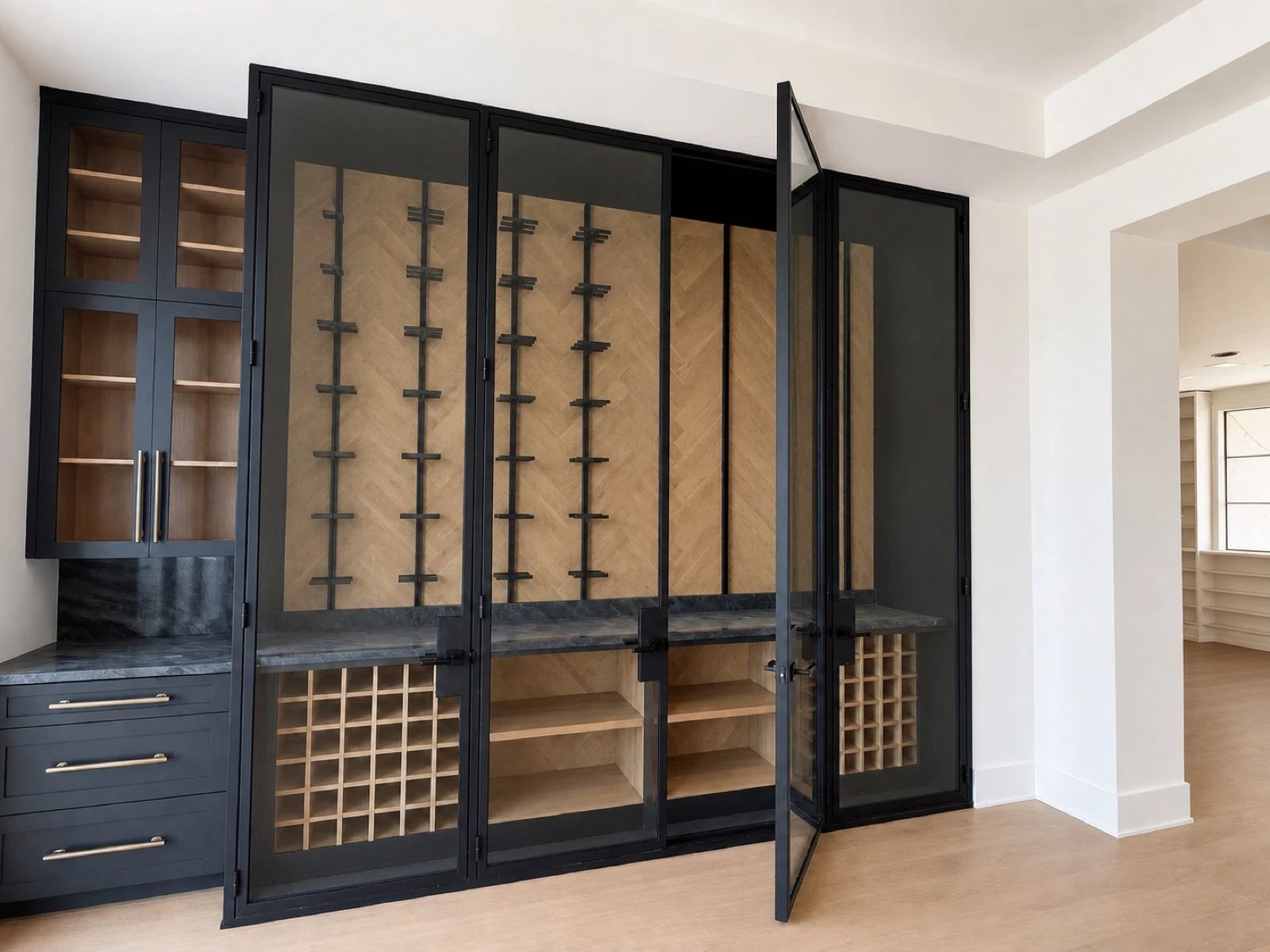 Four full-height black steel-and-glass wine-room doors, two shown open, revealing herringbone cabinetry in a Frisco residence