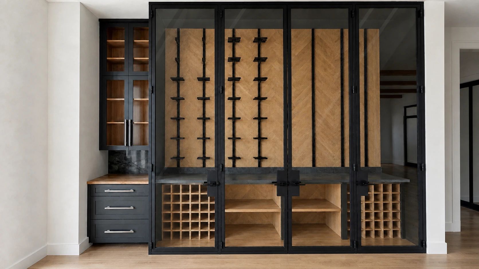 Wide straight-on view showing the complete black steel wine enclosure, threshold, and surrounding millwork