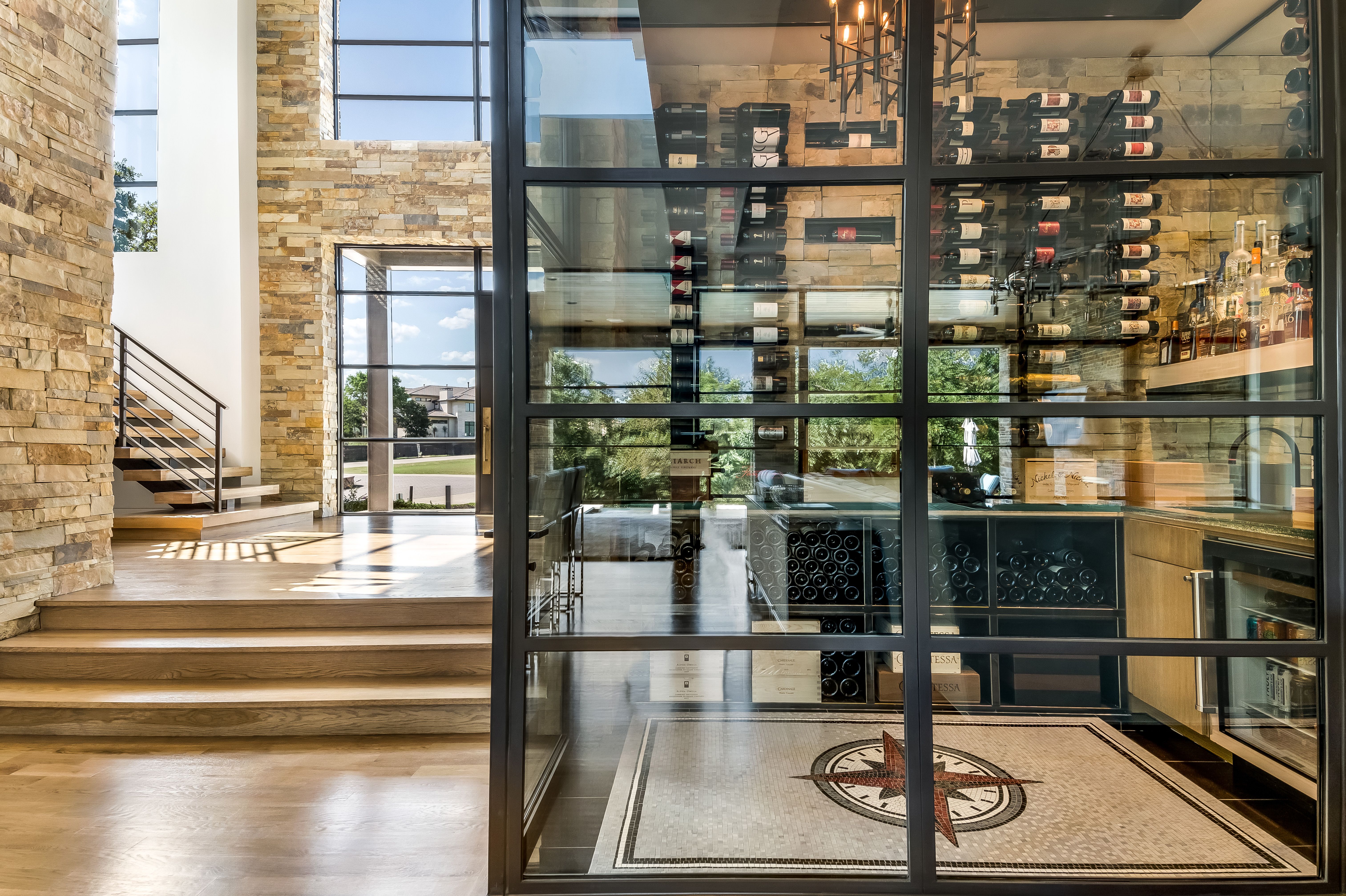 Glass-enclosed wine room in steel