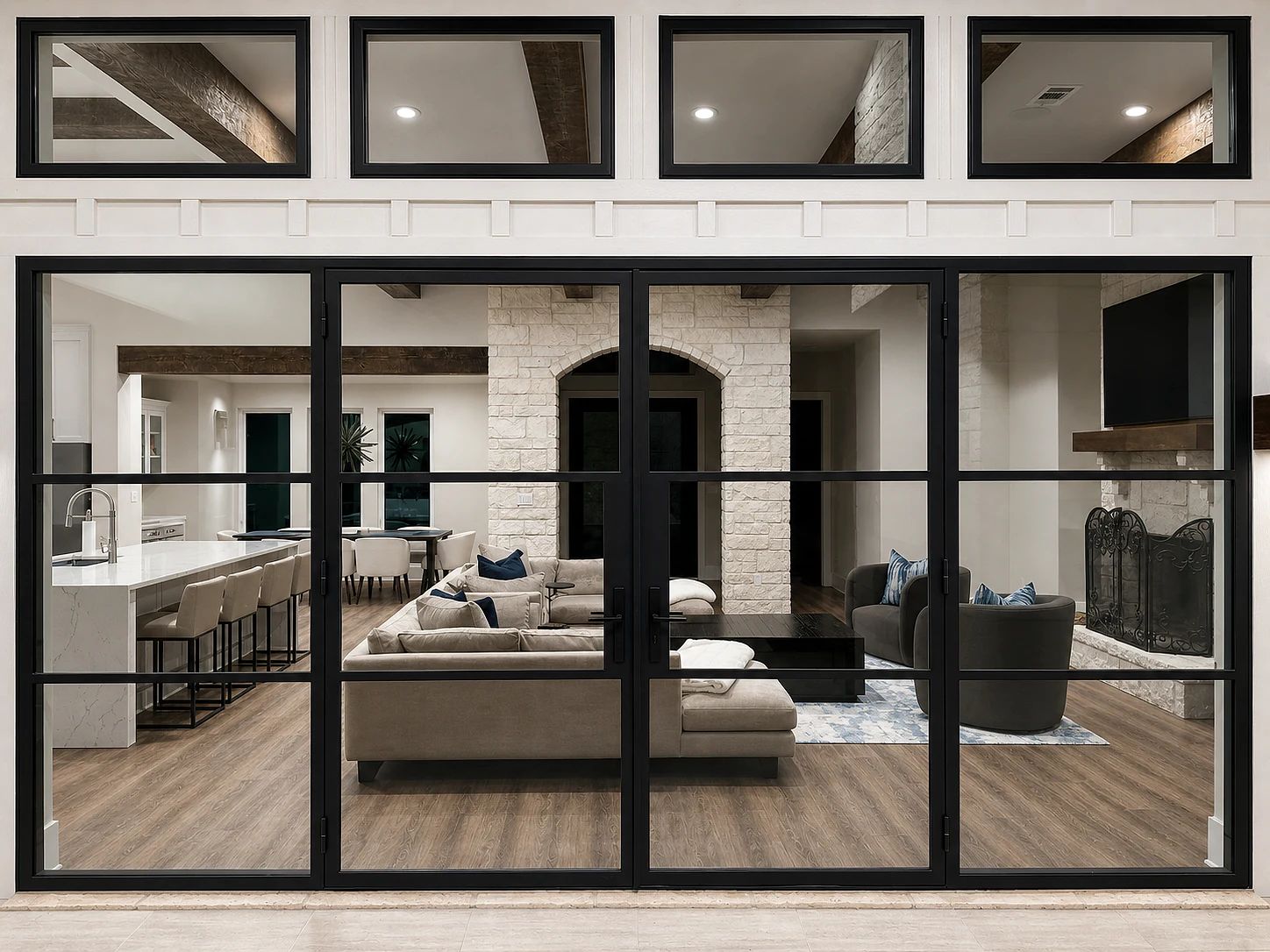 Straight-on exterior view of the completed 189-inch black steel patio wall at a Trinidad, Texas lakehouse