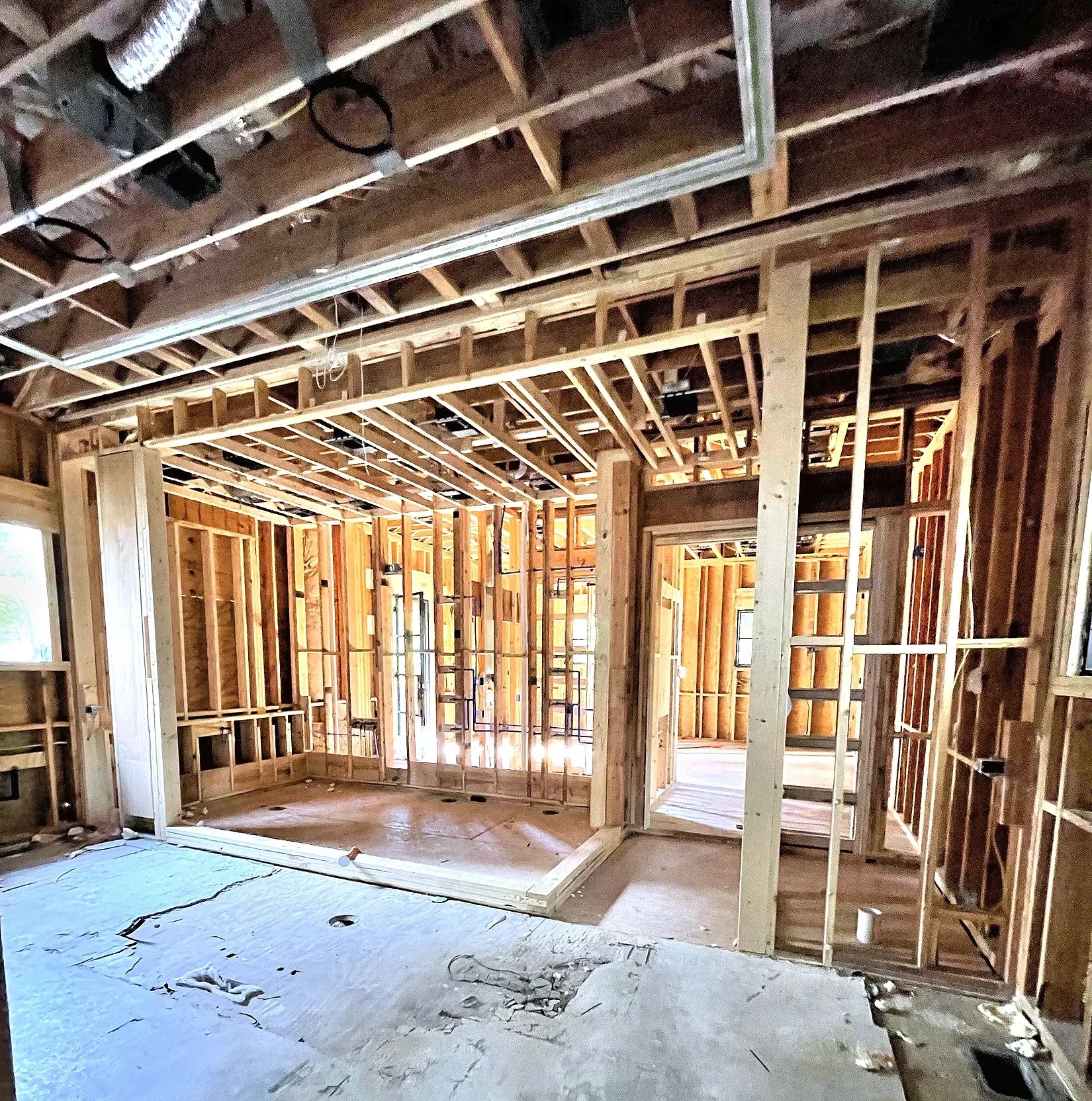 Primary bathroom wet-room footprint visible during the home framing stage before D'Hierro measured and fabricated the steel shower enclosure