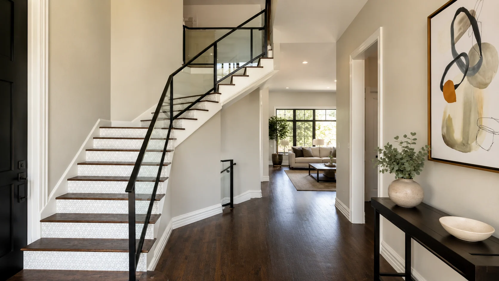 White stair with black custom iron handrail and guard