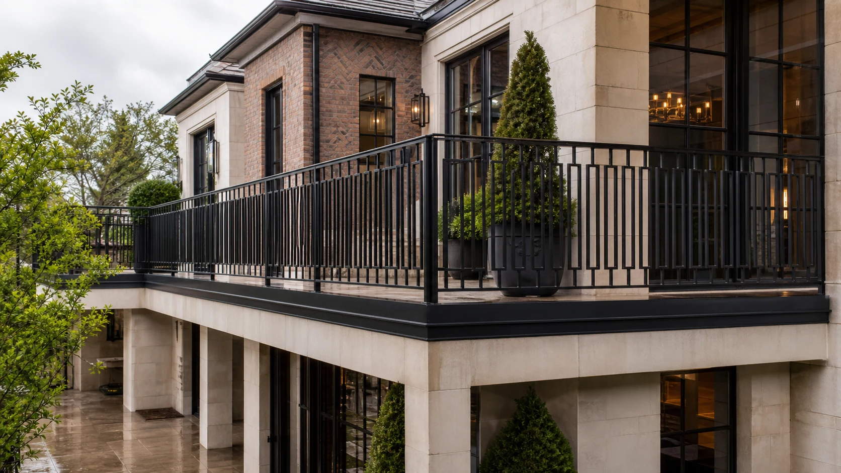 Wraparound terrace with a geometric charcoal iron balcony railing